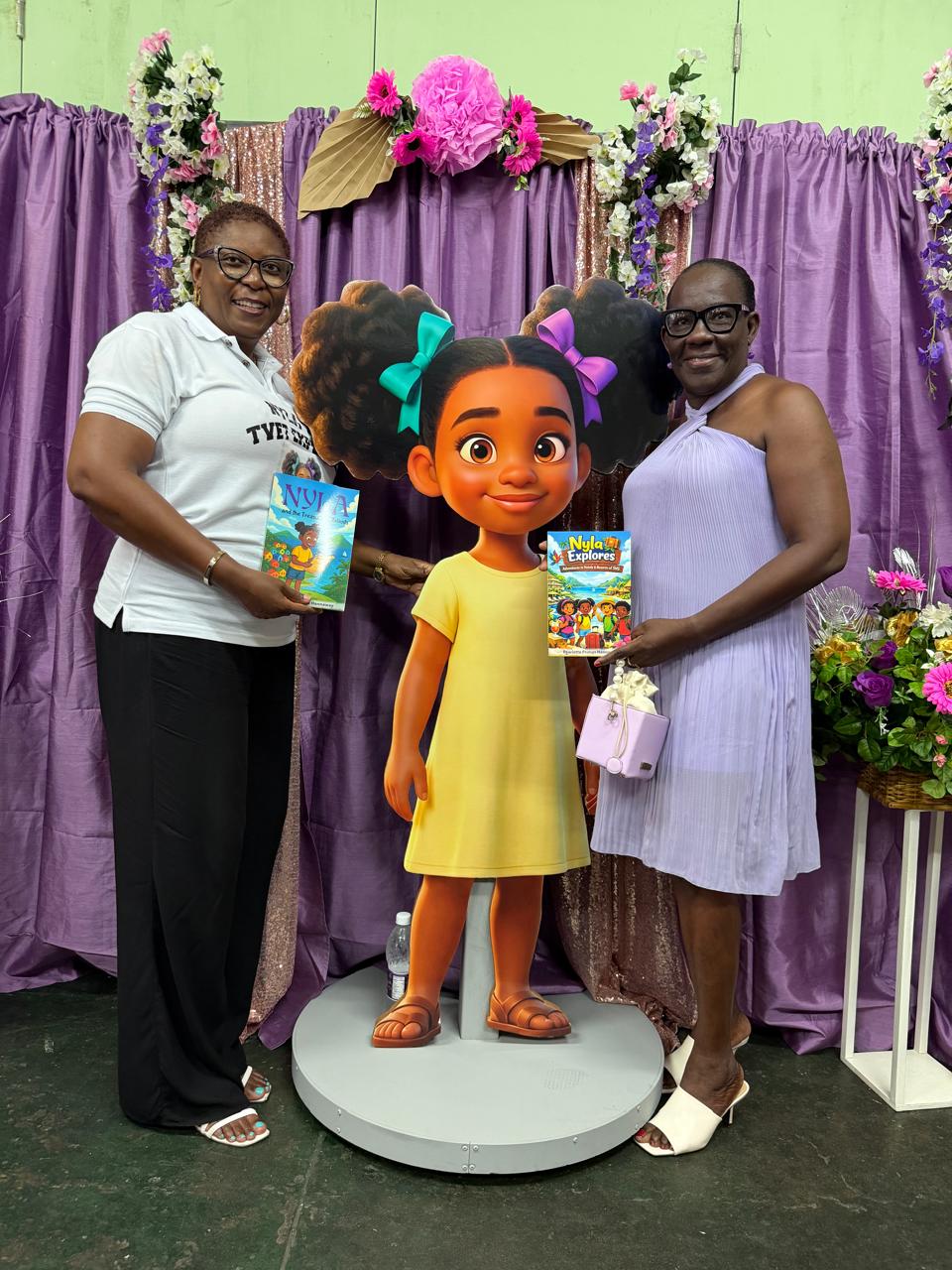 Pearlette Primus Hannaway beside the life-size animated Nyla character at her book launch